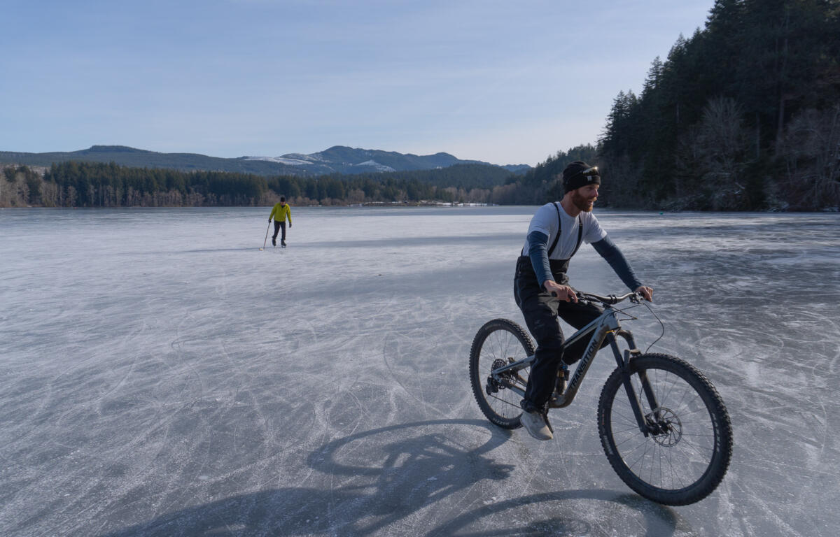 Two Bellingham men ice skate and bike across a frozen Lake Padden